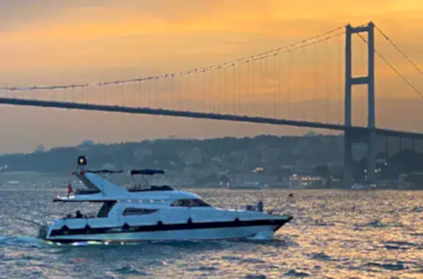 Image of a Bosphorus cruise boat at Istanbul sunset time in Turkey